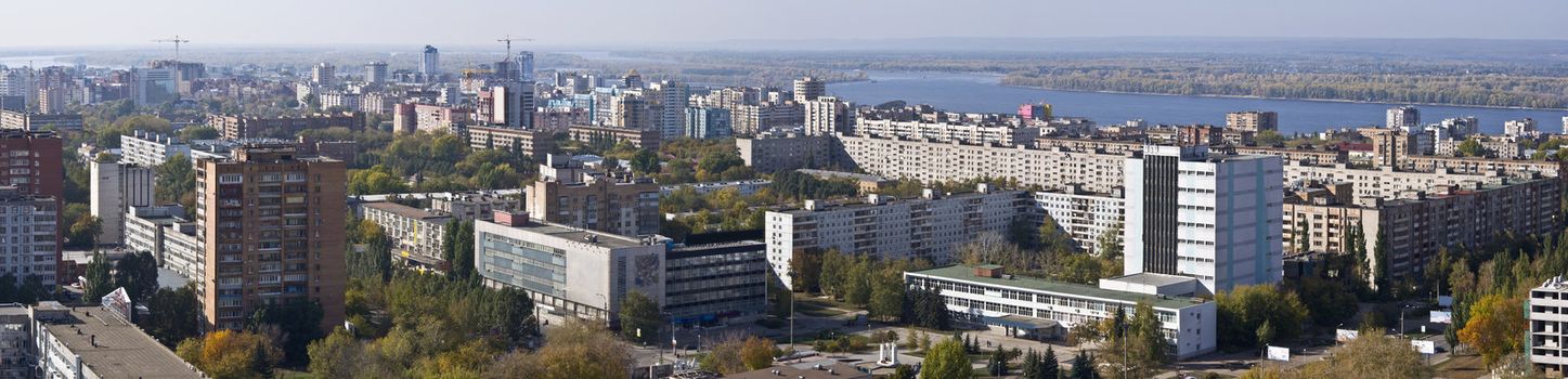 Urban landscape. XXL Size. Typical residential area on the riverbank. The view from the heights in the background the river Volga and Zhiguli Mountains. Russia.  