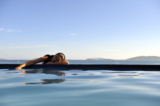 Pretty woman enjoying the swimming pool in Buzios, Brazil