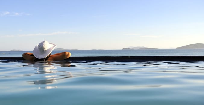 Pretty woman enjoying the swimming pool in Buzios, Brazil