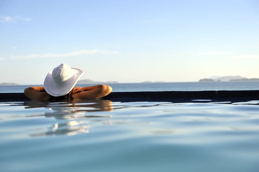 Pretty woman enjoying the swimming pool in Buzios, Brazil