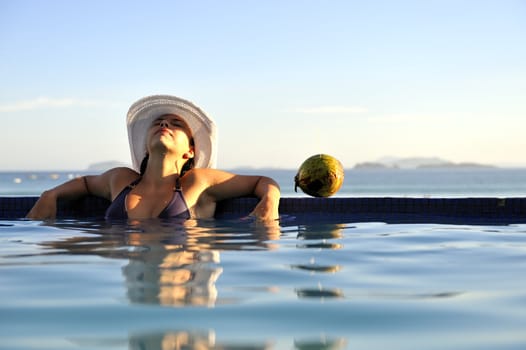 Pretty woman enjoying the swimming pool in Buzios, Brazil