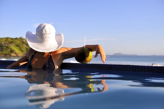 Pretty woman enjoying the swimming pool in Buzios, Brazil