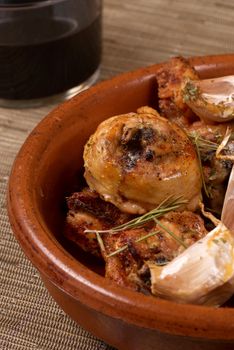 Traditional Spanish garlic chicken served in a clay pot