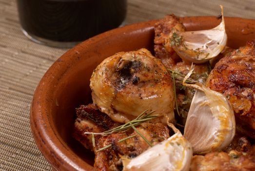 Traditional Spanish garlic chicken served in a clay pot