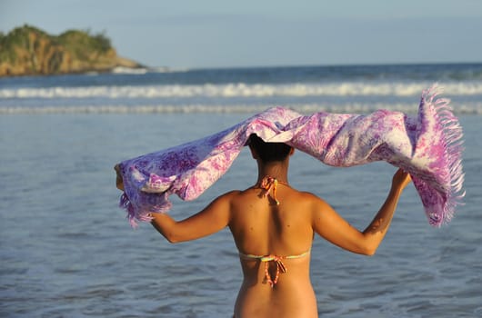 Pretty woman enjoying the beach in Buzios, Brazil