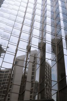 Abstract business buildings with reflection on glasses.