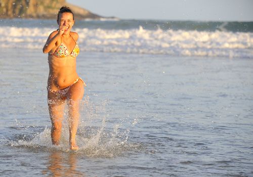 Pretty woman enjoying the beach in Buzios, Brazil