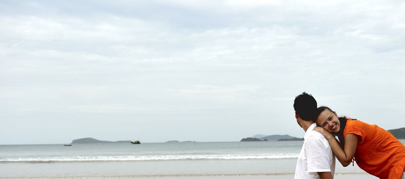 Loving couple having fun on the beach
