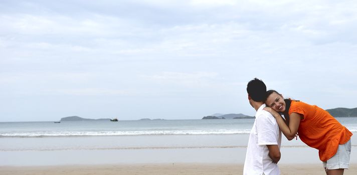 Loving couple having fun on the beach
