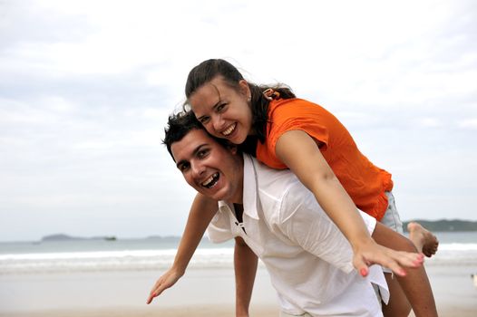 Loving couple having fun on the beach
