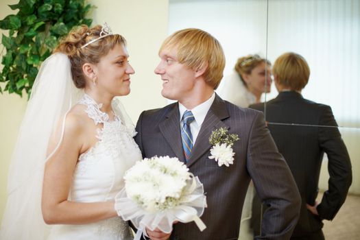 The bride and groom looking at each other