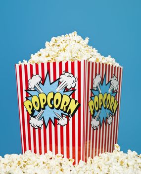 Basket of Popcorn on blue background
