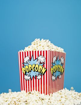 Basket of Popcorn on blue background