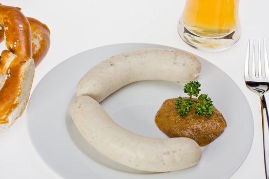 bavarian white sausage, wheat beer and pretzel