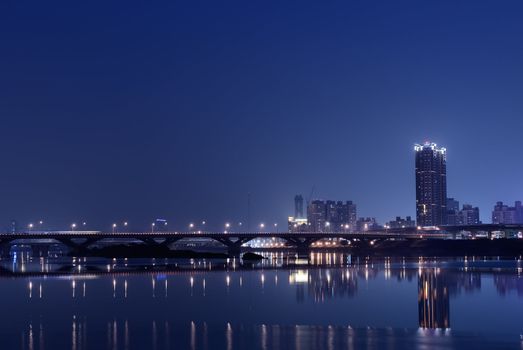 It is a lonely blue and purple city night.