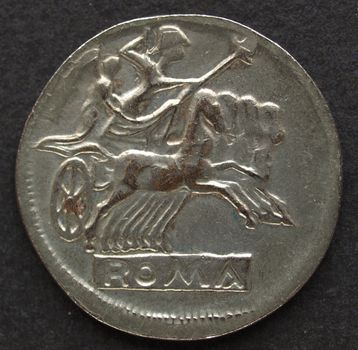 Ancient Roman coin on a black background