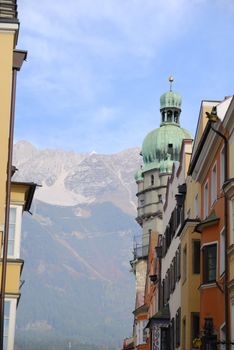 Tower of Innsbruck and alps in background