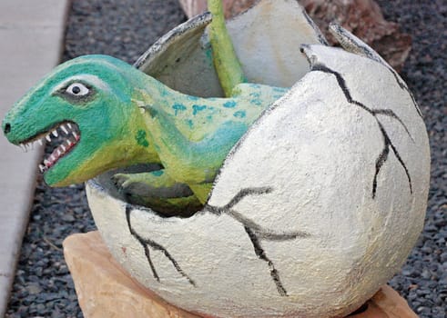 Dinosaur hatching out of egg