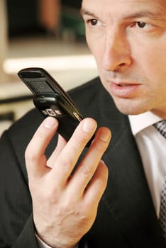 business man with mobile phone in hand