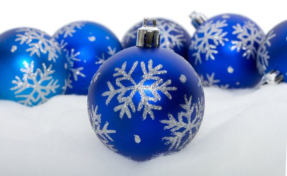 close-up blue balls with snowflakes, isolated on white