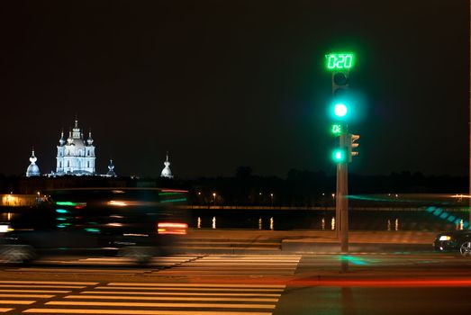 Car passes on a red signal of a traffic light on quay