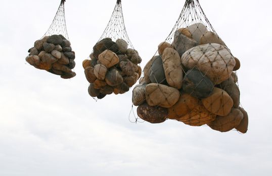 three groups of stones hanging