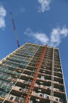 modern building construction work site, blue sky background
