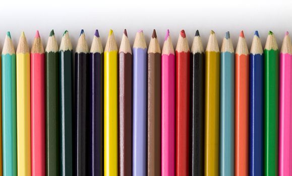 Set of color pencils on a white background