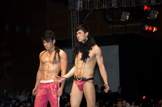 CHINA, SHENZHEN, GUANGDONG PROVINCE - APRIL 5, 2009:  The Fourth Shenzhen International Brand Underwear Fair with fashion show. Female and male models presents underwear and sexy costumes.