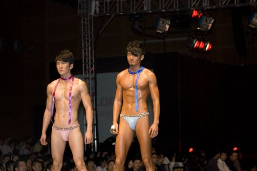 CHINA, SHENZHEN, GUANGDONG PROVINCE - APRIL 5, 2009:  The Fourth Shenzhen International Brand Underwear Fair with fashion show. Female and male models presents underwear and sexy costumes.