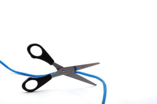 internet addiction concept with scissors and blue network cable on white