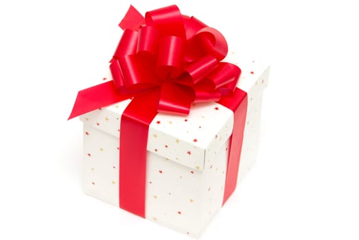 White gift box with red ribbon isolated on white