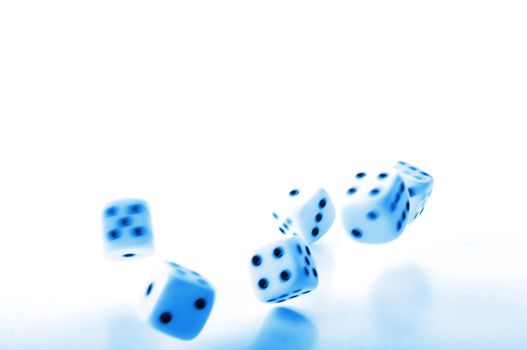 throwing dices in blue showing gambling or winning concept