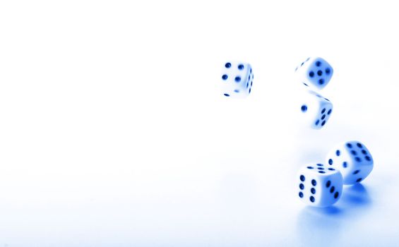 throwing dices in blue showing gambling or winning concept