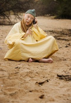 Wise Man in the Desert Talking on Cell Phone