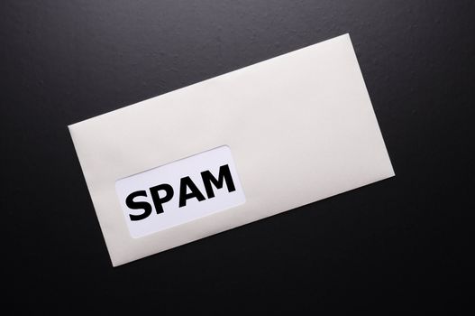 spam mail or e-mail concept with word on evelope