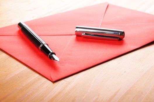 mail or email concept with envelope and pen