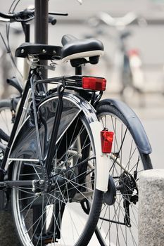 Two bicycle on the city street. Photo with tilt-shift lens