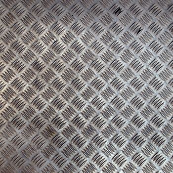 Diamond steel plate useful as a background