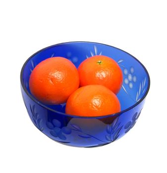  three mandarins in blue vase from top view on white background isolated