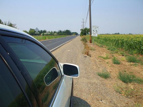 Long infinite road on a sunny day.