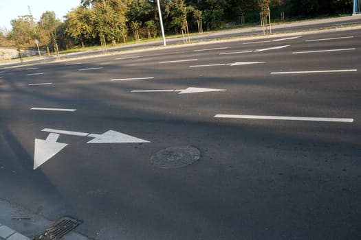 Main road with arrows painted on the asphalt