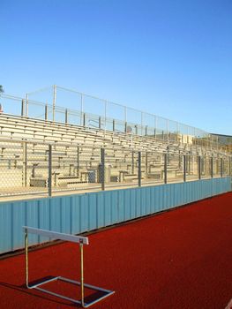 Empty bleachers on a stadium in a park.