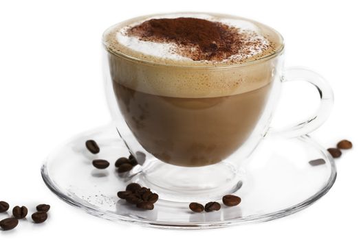 cappuccino with cocoa powder and coffee beans in a glass cup on white background