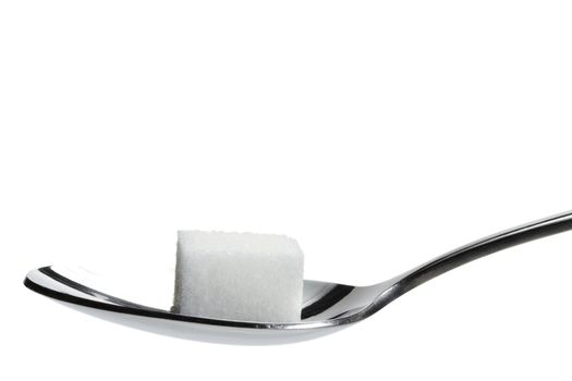 one lump sugar on a spoon isolated on white background