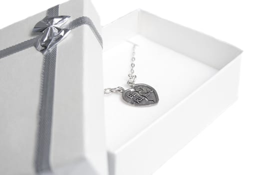 Small gift box with locket saying Best friends.