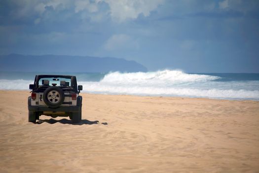 Offroad Vehicle on sand at a Remote Beach in Hawaii