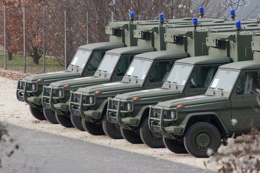 Millitary vehicles standing in line