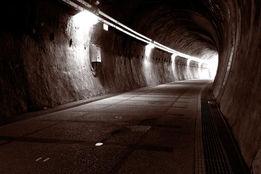 It is a sepia and lonely tunnel.