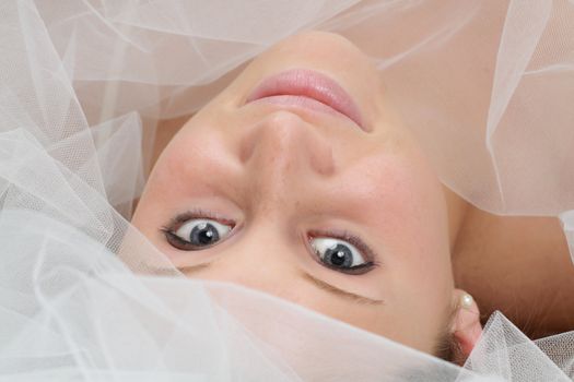 young caucasian woman with white tulle